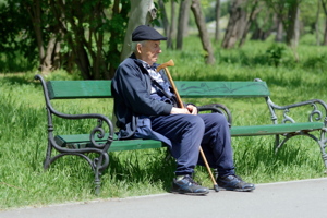 Elderly man sitting on a bench